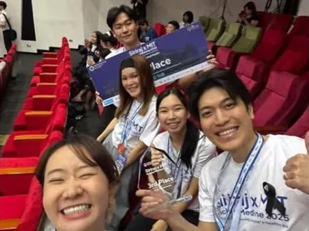 The stage screen reads: Mental Health, 3rd Place, Team 210 - Mind Odyssey.